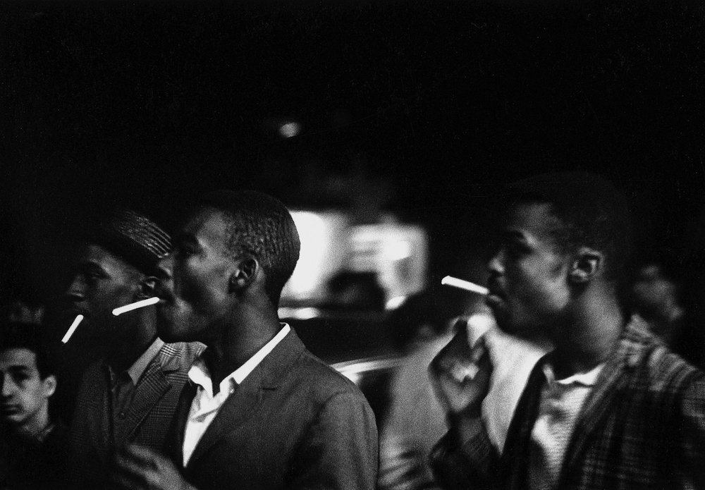 Al Fennar, "Rythmic Cigarettes, Greenwich Village, New York" 1964, photograph, gelatin silver print on paper All Rights Reserved  © The Estate of Albert R. Fennar  Image courtesy of the Fine Arts Museums of San Francisco.